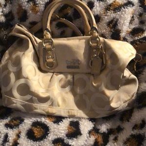 Coach handbag with strap.